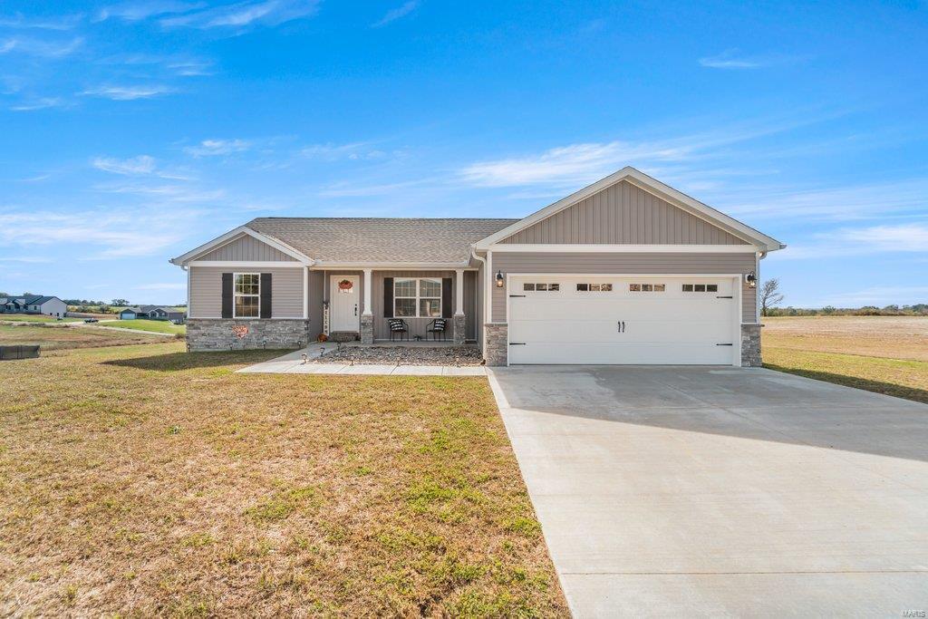 This beautiful dwelling embodies the peaceful serenity of country living yet only about a mile from town.  This (almost) new abode featuring a stone and vinyl exterior rests on an approx 1-acre lot leading way to tons of outdoor enjoyment for the entire family.  Stepping through the front door you will be greeted with an open concept living space and so much more.  The dreamy kitchen offers tons of white cabinetry to include a center island breakfast bar along with granite countertops.  This home has a split bedroom floor plan along with a main level separate laundry room.  The full walk-out basement is unfinished so you can complete to fit your wants and needs when and if that time comes.  Don't miss your chance to call this wonderful home yours! Schedule to see it today!