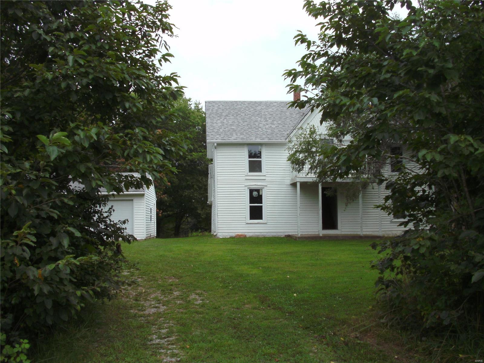 This large 2 story home includes 3+/- acres, a 2-car detached garage/shop and 2 older sheds. It is located on blacktop and within walking distance to Whetstone National Park that has great hunting/fishing! This home includes 4 bedrooms and 2 baths. It has been updated with a new kitchen, bathrooms, flooring, windows, central heat and a/c, insulation and electric.  All done in the past few years.  The porch and foundation have also been improved.  It includes newer plumbing & roof too. This property has a great location and would make a nice home or bed and breakfast!  Being near the large conservation area, it gives you more land for fishing and hunting.   Survey has been done.  Call for appt.