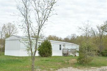 This is a nice starter home on 4.92 acres.  It is in Dallas County but is in the Conway School District.  Nice wooden 10x12 shed stays with property. Nice fenced garden space.