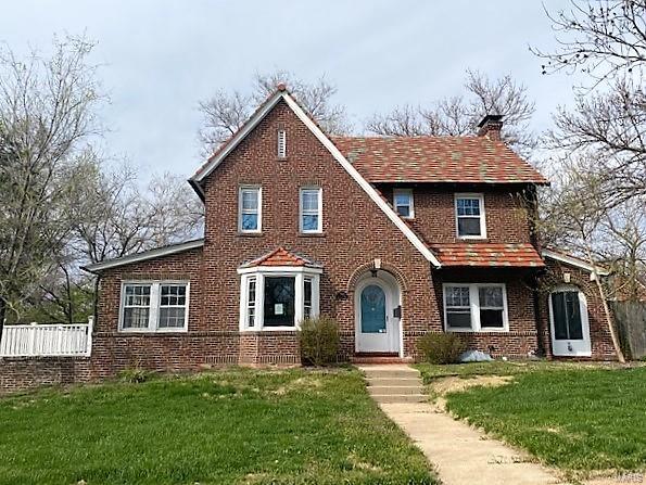 Huge Price Reduction!  Architectural detail and charm fill this classic University City home. Historic architectural details include beautiful wood floors, french doors, arched doorways, kitchen with white shaker cabinetry and granite tops, fireplace, and sought after center hall floor plan. Upper level boasts 3 spacious bedrooms and 2 full bathrooms.  Lower level rec room leads to attached 2 car garage.  Fenced in level yard, wrap around driveway, sunroom, deck, and patio.  Sought after location within minutes of Clayton, Washington University, Forest Park, and I-64/170, will not disappoint.  Ready for your finishing touches!  Don't wait, call today!