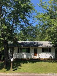 Charming updated home.  Beautiful hardwood floors with woodburning fireplace.  Very open floor plan with updated kitchen and bath.  Hardwood floors in both bedrooms.  Kitchen is huge with dishwasher,  pantry and built-in microwave.  This home is very private with huge deck and located at the end of cul-de-sac.  Basement has a walk-out with french doors and there is a huge shed in the backyard.  ALL ELECTRIC.  
THIS IS A MUST SEE.