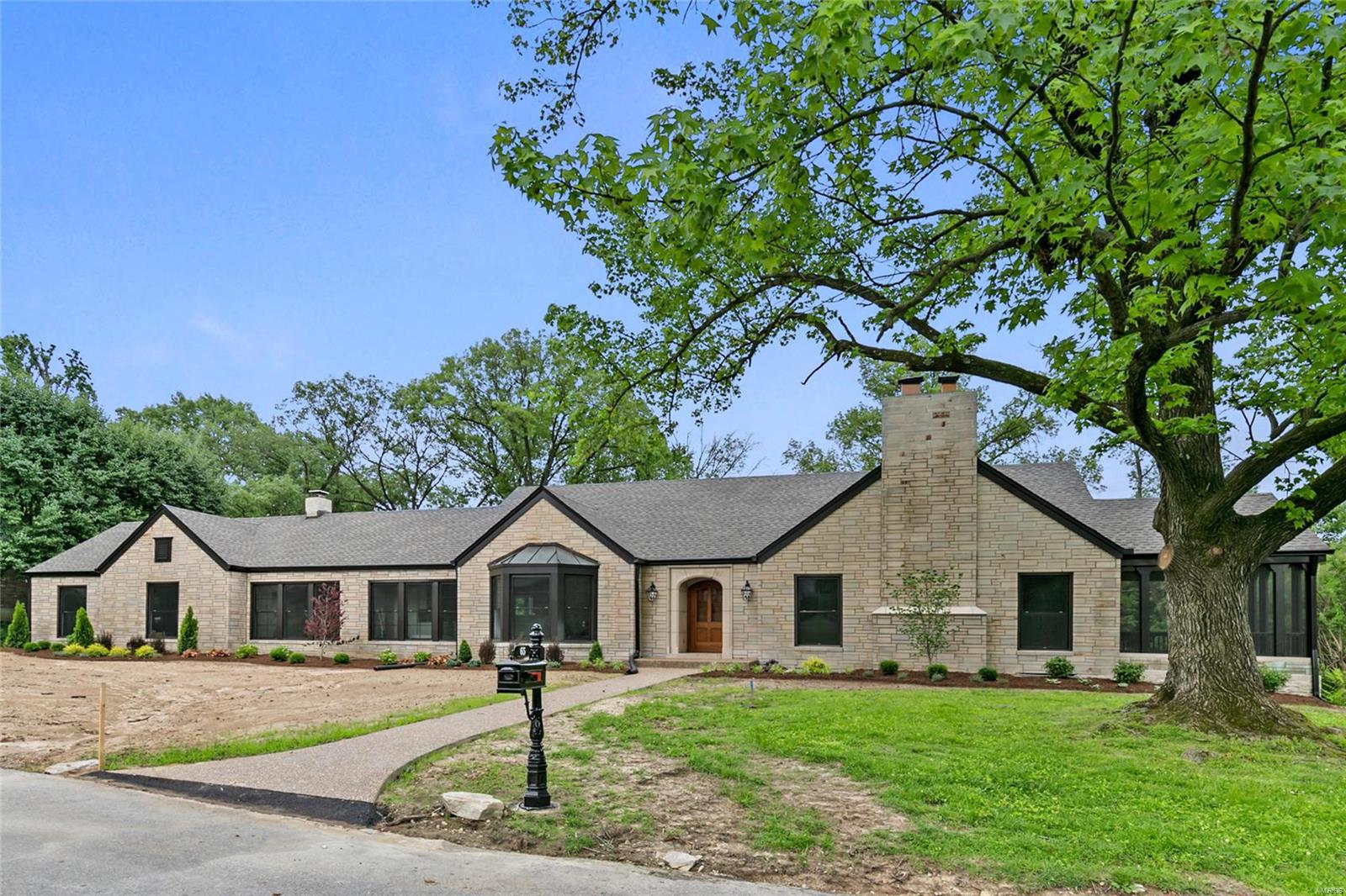 Wonderfully renovated story and a half home. Great neighborhood. Open floor plan great for entertaining. Kitchen features custom cabinetry with granite counter tops, over sized island, pantry cabinet, tiled backsplash, and more. Appliances include, two ovens, 36” 6-burner gas cook top, drawer microwave, and refrigerator. Flexible kitchen, breakfast room, family room, den, and living room afford many options for different lifestyles. Spacious first floor laundry room with custom cubbies and room for planning desk/hobby area. First floor master suite features double vanity with granite top and a walk-in shower. The second floor has three bedrooms, one bath, and a loft area. Finished lower level with a stone foundation walls, terrazzo floors, wet bar, and bathroom. New 30-year architectural shingle roof. Ladue Schools, Conway Elementary. The inside is finished and staged. The exterior is landscaped.  Sod and irrigation system are scheduled for late July.