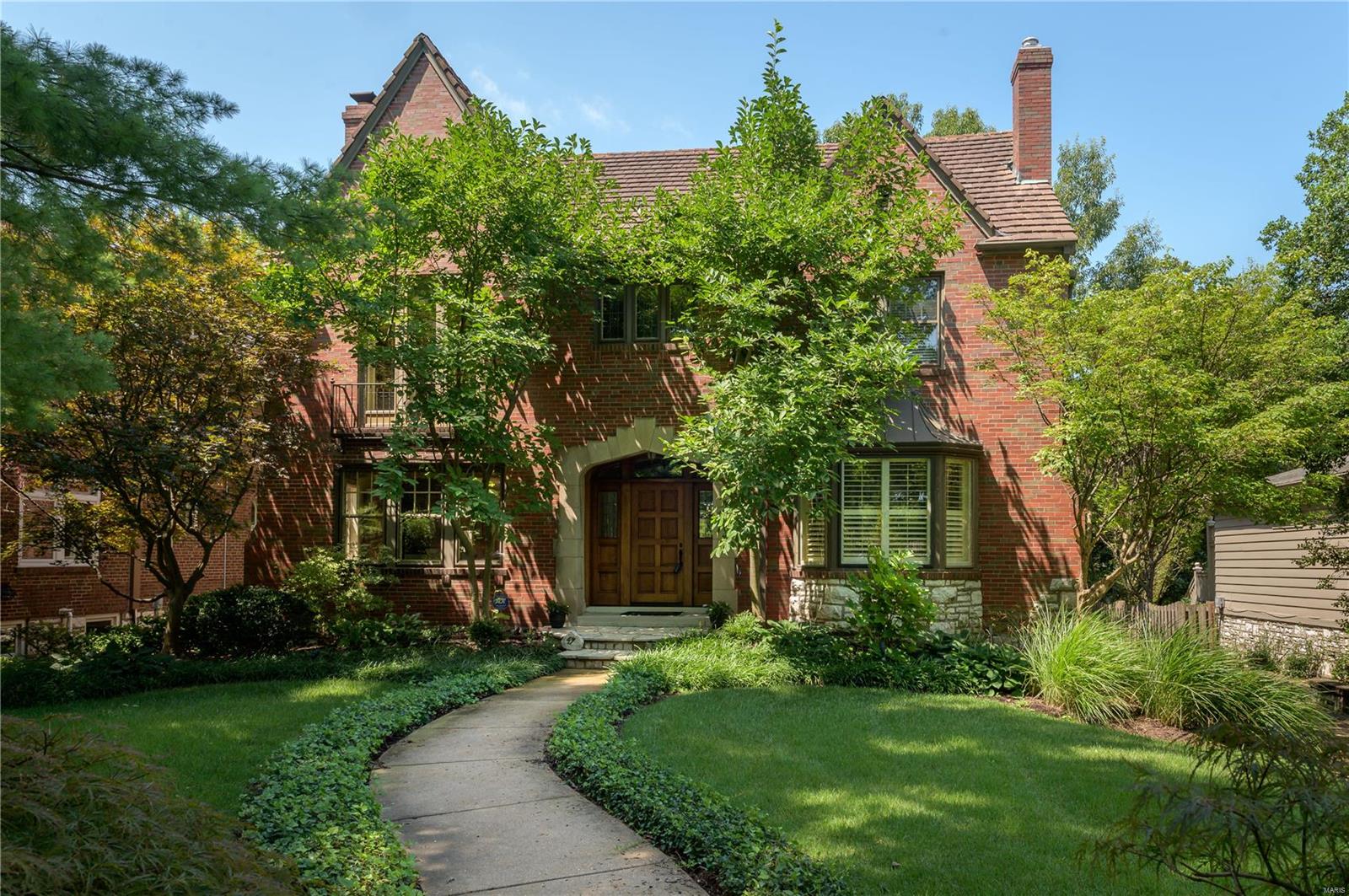 Great Opportunity! Classic home blends original workmanship with modern and stylish updates. The handsome arched stone & brick covered porch with custom mahogany door & leaded glass side lights opens to a light-filled home with an abundance of windows, eight panel doors, moldings, built-ins & custom finishes. Beautiful inlaid hardwood floors,Living Room with fireplace, generous sized Dining Room with bay window and plantation shutters, Office, Family Room addition with vaulted ceiling, clerestory windows & gas fireplace opens to the charming screened-in porch & looks out to the gorgeous, level, professionally landscaped yard. Gourmet kitchen w/granite countertops, stainless appliances, breakfast bar & breakfast room. The private Master suite includes two walk-in closet and a large spa-like bath. Two additions bedrooms, full bath & craft/office completes the 2nd floor.  The 4th bedroom suite encompasses the 3rd floor.  Finished Lower Level, half bath, laundry & oversized 3 car garage.