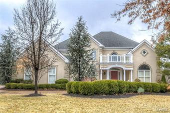 Magnificent Miceli-built 1.5 Sty with exceptional design features & high end finishes throughout! Impressive 2-sty marble foyer highlighted by sweeping staircase opens to elegant dining room and 2-sty great room with architectural columns, elaborate fireplace, wet bar & wall of windows with private wooded views. State-of-the-art kitchen with 42” cabinetry, granite countertops, Viking Professional appliances, center island & butler’s pantry adjoins breakfast room with planning center & vaulted hearth room with brick fireplace. Sumptuous master bedroom suite with 2 walk-in closets, marble bath & sitting room. 3 Additional bedrooms, 1 with private bath & 2 with Jack n’ Jill bath, complete the living quarters. Incredible walk-out Lower Level includes recreation room with entertainment center & fireplace, 2nd kitchen, game room, wine cellar, guest suite & workout room with adjacent hot tub room & bath with steam shower. Premium lot with deck, patio with grill center, pool & 3-car garage.