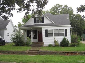 3 or could be 4 bedrooms, 2 bath home with hardwood floors & tile floors with 1 car detached garage.  Property is move in ready.