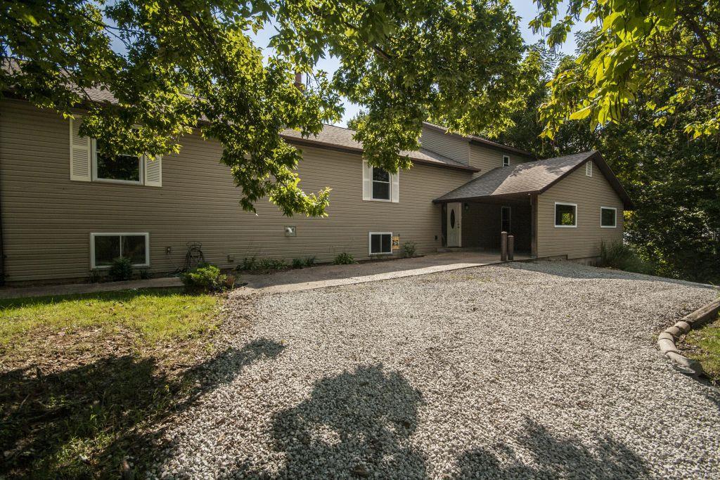 FALL in love with this beautifully updated contemporary home and yard!! All applicants must pass credit and criminal background check. Application fee is $40.00 Security deposit is $2,000.00. Pets acceptable with additional fee and approval of homeowners. With over 3000 sq ft and nearly a half acre this modern 5 bedroom 3 full bath home features a large master suite with THREE closets, a full bath and stand alone vanity. The kitchen features updated appliances, a breakfast bar and an island that seamlessly flow out into the open living area. This house is perfect for the entertainer boasting a recreation room with built in bar. The large deck and patio with built in fireplace which overlooks a huge level yard is the perfect place for family and friends to gather! Two car garage, car port and wrap around driveway! Don't miss out on all the space that this house to offer!