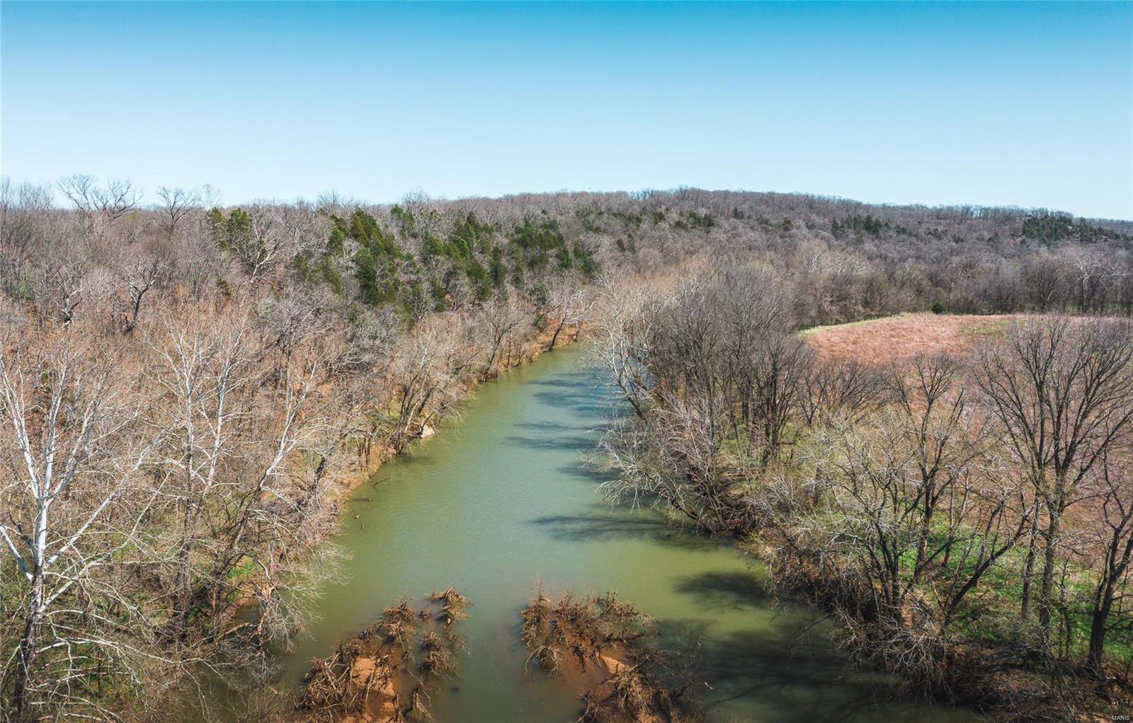 Nestled in the hills is this riverfront farm that has it all including a small pond. Over 1300 ft. of Big River frontage known for some of the States top small mouth bass fishing. Property is loaded with deer and turkey and is a great mix of open bottom land, pasture, and timber. The pasture land could easily support some farming for wildlife opportunities or make a wonderful cattle operation. The views on the this farm say it all and is the perfect Missouri land getaway. If you want to return to a lifestyle that is away from it all this is the perfect place. Missouri riverfront land like this is hard to locate and only 45 mins from St. Louis, MO makes this the perfect recreational retreat for full time living or that special weekend property.