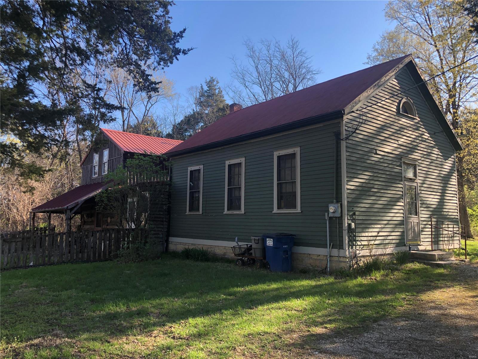 Are you ready to own a piece of history? Welcome to 17005 Legion Hall Rd., formally known as the Cedar Grove School House. Listed BELOW appraised value, this building has transformed over time by hand of the previous owner, with adding a fabulous log cabin to the structure, with beautiful hand-made hardwood floors. Located on 4.76 acres, this historic structure boasts high ceilings in your combined kitchen and dining area. Head to the back of the home where you'll find your living room and main floor master bedroom. Upstairs in your loft area, you'll find your second large bedroom. There is plenty of outdoor space to stretch out here. With a little love, the possibilities are endless with this charming property. Come and make it your own today!