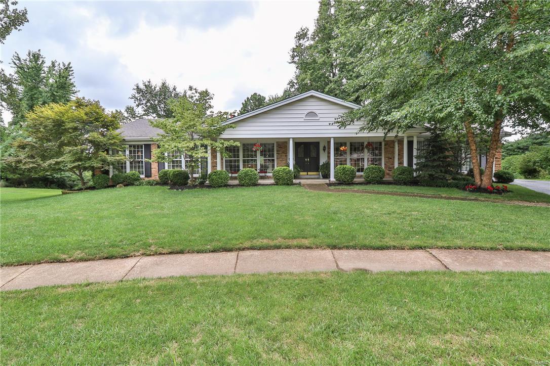 This house has it all! Located in popular Ladue Trails, situated on an almost half acre private lot in a quiet cul-de-sac, this ranch home has amazing curb-appeal which sets the tone for what you will find inside. From the inviting covered front porch, step into the foyer to view the light-filled open floor plan. The foyer is flanked by a spacious living room & dining room w/huge windows & beautiful wood floors & opens to the family room w/stunning views of the private back patio & yard. The family room boasts of a brick fireplace flanked by bookcases & wall of slider doors to access the patio. The cheery white kitchen & breakfast room opens to the family room for easy everyday living & entertaining. A huge master suite w/sitting area, en-suite updated bath & walk-in closet, 2 more good-sized bedrooms, updated hall full bath & guest bath complete the main floor. The lower level offers fabulous additional living space w/a beautifully finished rec room. Attached 2 car garage. A must see!