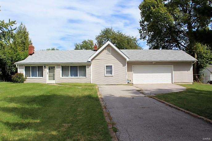 Welcome home! This 3 bedroom 2 full bathroom home in the Lindbergh school district is ready for your personal touch! Featuring a spacious eat in kitchen, Refrigerator, electric range, built in microwave oven. a warm and cozy living room filled with natural light, fresh carpet accented with a functional wood burning stone fireplace.  All three bedrooms are spacious with carpeted and lots of closet space. Master bedroom includes an attached full bathroom and personal walk out to back deck. Main floor laundry with an attic fan. Slab home adding the convenience no stairs.  Oversized attached 2 car garage with tons of extra space for storage, complemented by a 6 vehicle tandem parking driveway. Large, level, fenced in backyard featuring a deck and shed perfect for pets, kids, and entertaining. Conveniently located near shopping centers, Restaurants, Schools and easy access to I-270 and I-255