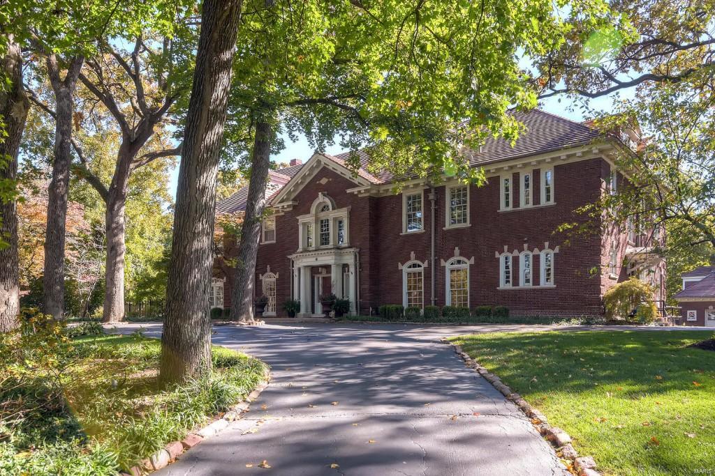 Magnificent 3-story Georgian Colonial built in 1914 by Charles B McCormack & Son situated on a gorgeous 1.23 acre lot in one of the most prestigious neighborhoods in STL.  Outstanding architectural design & detail from floors to ceilings provides both elegant entertaining and comfortable every day living.  The grand foyer includes an open staircase w/ balcony & stunning chandelier & opens to the dining rm with french doors leading to the patio.  The formal living room joins a light filled sun room. Top-of-the-line kitchen & breakfast room opens to the wood paneled den.  A butlers pantry, 2 powder rooms & mud room complete 1st floor. Upstairs, a gracious master suite w/walk in dressing closet & sitting room with fireplace, updated master bath, 3 bedrooms, 3 baths, laundry & fitness/5th bedroom. 3rd floor offers a 6th bdrm, rec room & 7th bdrm/office. A covered brick patio offers serene views of the grounds & pool.Finally,a fabulous apartment on the 2nd floor of the 3-Car carriage house. Additional Rooms: Sun Room