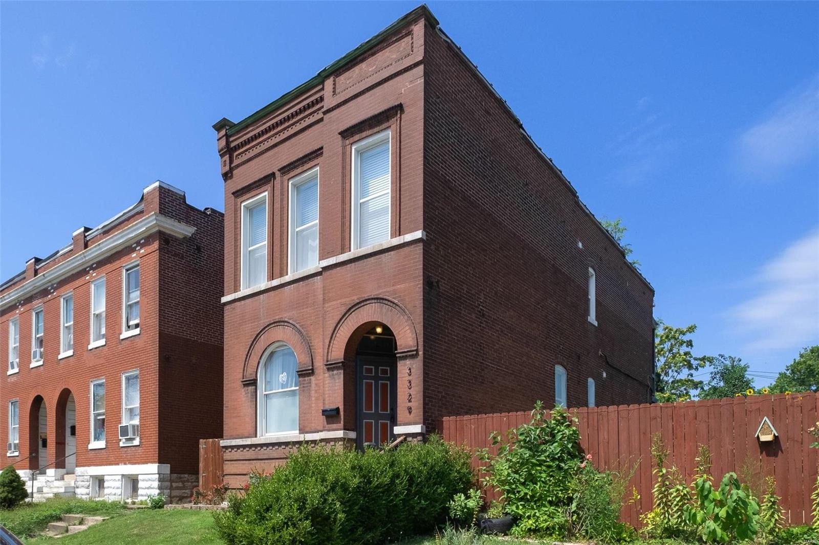 Just 1/2 a block from all the hip action on Cherokee Street! Enjoy a short walk to Earthbound Brewing, The Mud House, The Whiskey Ring and so much more! Open main floor living with hardwood floors, original pocket door, custom wainscoting, crown molding, 9.5'' baseboards, decorative fireplace with electric insert, built-in ceiling speakers (both floors) & exposed brick. You'll discover the cutest office nook tucked around the corner from the dining room. The modern kitchen features a massive island, custom cabinetry, granite tops and stainless appliances. A full bath by the office area rounds out the main floor. More exposed brick leads you upstairs to 3 large bedrooms and a bathroom. You'll find the master bedroom towards the back of the home with a private balcony and two closets. The walk-out basement has a cute 13'x15' laundry room and ample room for storage. Outside is a 14'x9' deck, a fenced in yard and a 1 car parking pad.