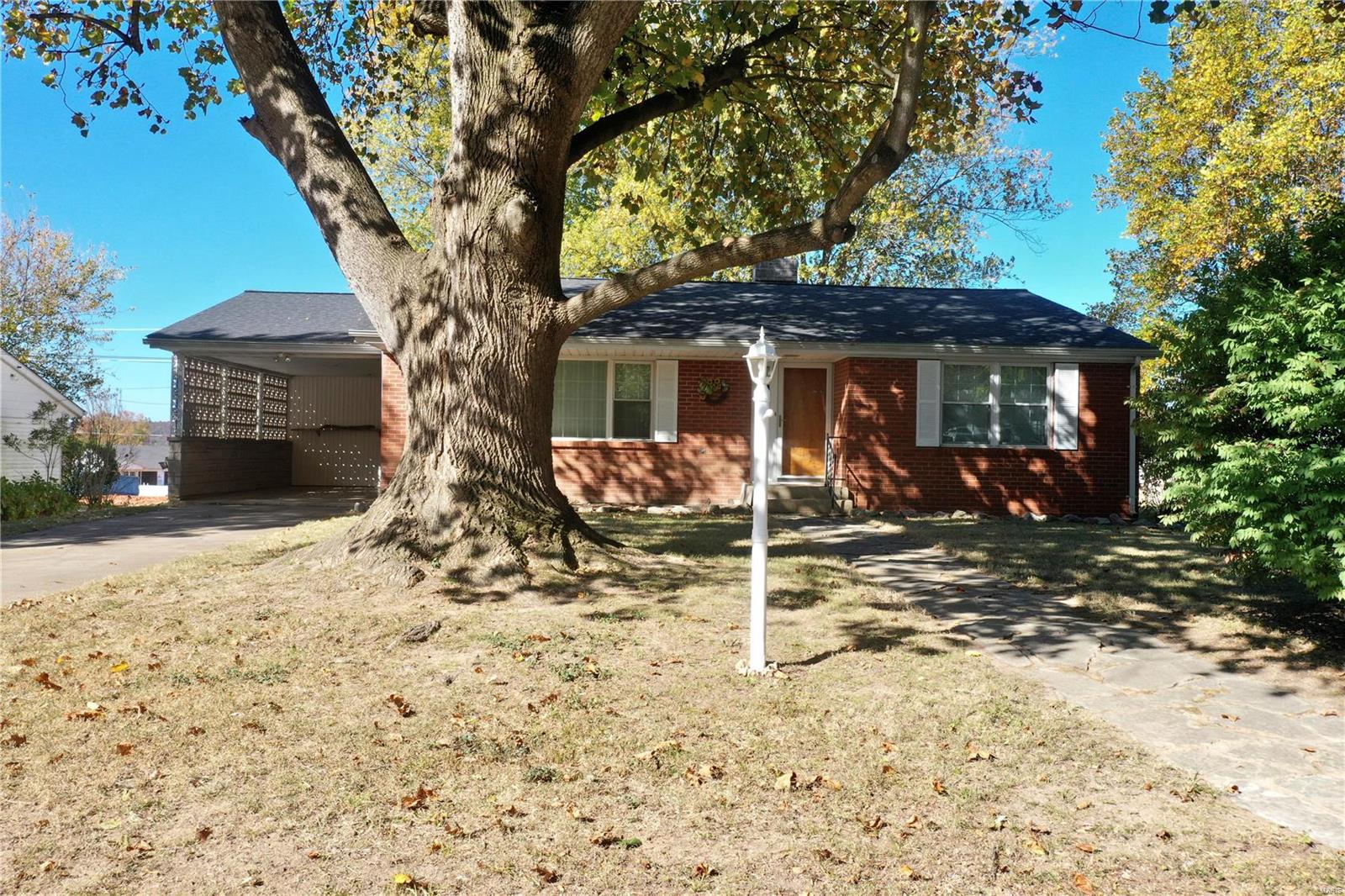 Well maintained and move-in ready, this one is worth the look! Spacious ranch style home located on a dead-end street in an established neighborhood. Expansive living/dining room, kitchen with ample cabinet space, main floor laundry, two sizable bedrooms, and full bath. New flooring and paint throughout the main floor.  Downstairs in the partially finished basement you will find a family room, additional room that could be used for a sleeping room, office, exercise room, etc. Half bath, and plenty of storage options. On the exterior you will find a low maintenace yard, covered parking in the carport with storage/work space around back, and patio that would be ideal for entertaining. You don't want to miss the opportunity to view this one, call today!