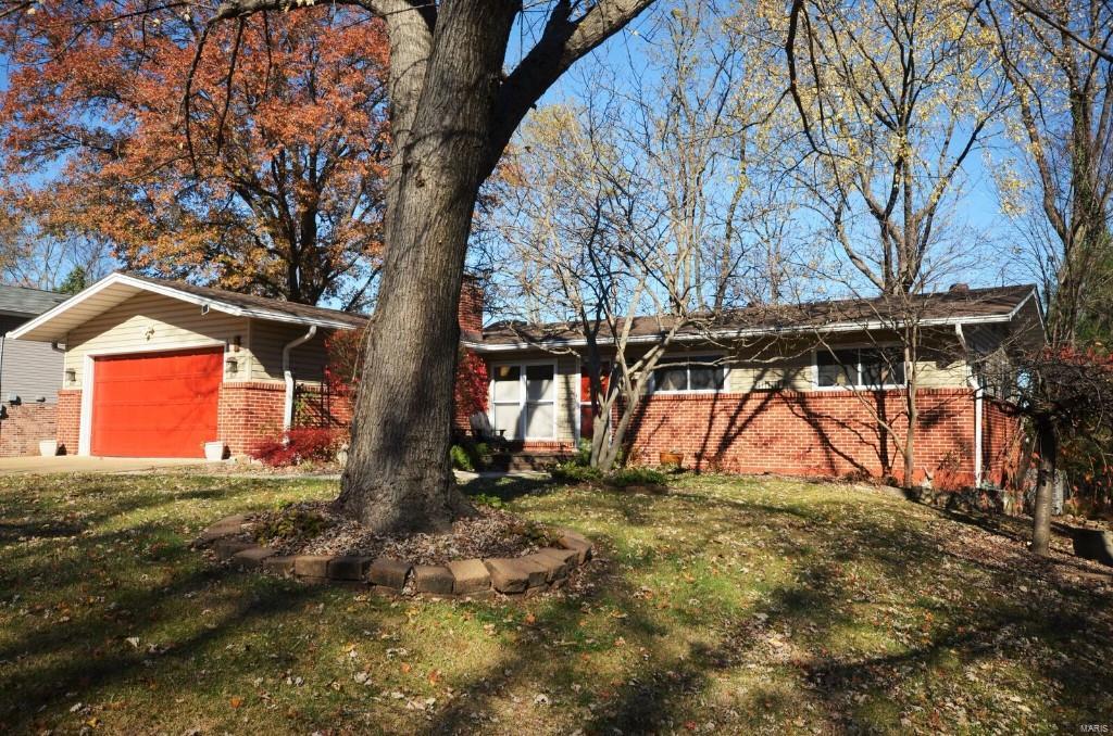 GEM GEM GEM of a RANCH Home in a Fantastic Location is the New Home You've Been Waiting For!  Don't miss out on this 3 bedroom 2.5 bath ranch with real oak refinished hardwood from corner to corner on the first floor.  Enter into the vaulted great room with woodburning fireplace and doors out to the huge concrete patio with pergola and your oversize two-car garage.  The kitchen is a chef's dream with custom cabinetry, GRANITE countertops, Stainless Steel Appliances, and windows and doors overlooking the maintenance free deck with low voltage lighting overlooking the fenced backyard with mature trees.  Master suite with custom tile shower.  FINISHED WALKOUT LOWER LEVEL with Den, Family Room Area and large laundry and workshop area with a 1/2 bath in the lower level.  Upgrades and Recent Updates include HVAC, Roof, Skylights, Refinished Hardwoods, six-panel interior doors, custom kitchen and tile shower, seamless gutters with guards, plus it has a completely fenced yard. HURRY OVER TODAY