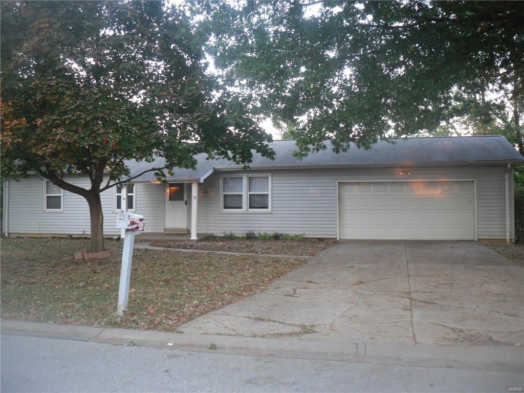 Welcome home! This great home offers a living room with laminate wood flooring and picture window, kitchen with newer ceramic tile flooring and plenty of cabinets, 3 bedrooms on main level with 1/2 bath  in 1 of the bedrooms along with a full bath in hall. From the kitchen, you go down stairs to the finished lower level rec room with bar, laundry room, another full bath and a sleeping area. The exterior features an oversized 2 car garage with door leading to the fenced in back yard, a utility shed for storage and horseshoe pits. This home is conveniently located close to schools, shopping and restaurants and is in USDA territory!
