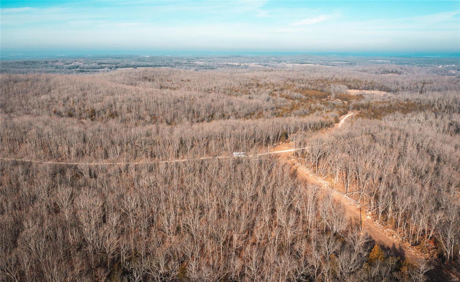 16.4 m/l acres located in Pulaski County. The tract is in close proximity to Ft. Leonard Wood and the Mark Twain National Forest for great deer and turkey hunting. Graveled access roads with private entrance are located just off Highway AB for easy access in and out of property. A well will be needed for building sites as the public water runs along AB Highway on the South side. Electric being added across tract and along access road next to tract. Property is agent owned. all tracts have been surveyed individually and are completed.
