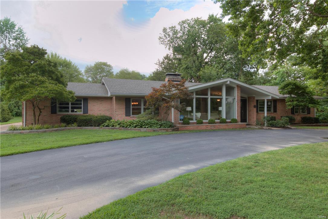 Spectacular  4 bedroom, 3 bath Brick Home in the " Premier Ladue School District " Offers some updates! This Beautiful renovated  Ranch Features Expansive Windows, Gleaming wood floors, soaring ceilings and equisite see through fireplace. Spacious open kit offers wall of windows, white Newer Roof, Pool Pump, Pool Heater Gleaming Wood Floors, Soaring Ceilings and Exquisite see through Fireplace. Spacious Open Kitchen offers a Wall of Windows, White Cabinets,  Upgraded Stainless Steel Double Built in Ovens, t Cook top, Granite Counter tops and a "Large" Center Island. This 4 Bedroom offers Newer Carpeting and 2 baths with Upgraded Granite. The Extensively Landscaped Lot offers a Circle Driveway, Rear Entry Oversize Garage, Patio, Built in Pool w/Diving Board, Slide, Spa and a Brick Wall for Privacy !This is a fantastic opportunity.