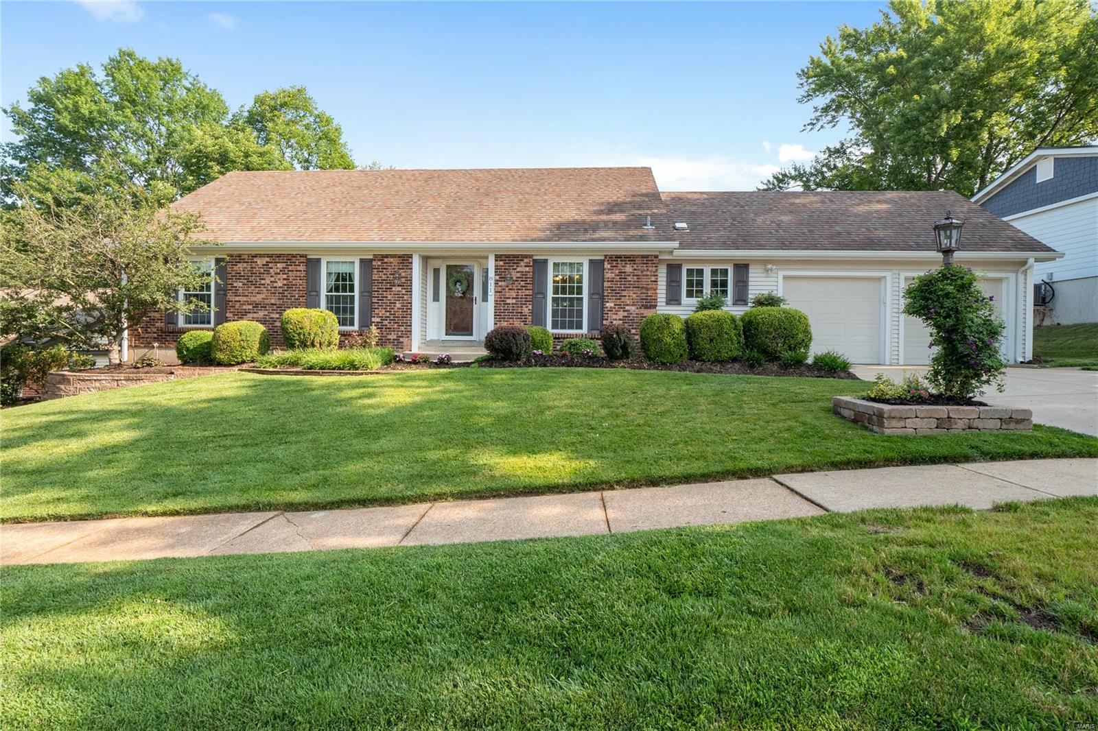 Welcome to 811 Big Bend Woods Dr.! This charming ranch-style home with a farmhouse flair offers enduring curb appeal. Boasting 4 bedrooms and 2.5 bathrooms, this home is perfect for those seeking a cozy retreat. Step into the heart of this home to discover an updated Chef's kitchen featuring painted cabinets enhanced by stylish hardware, a stunning backsplash, granite countertops w/undermount sink, SS appliances and durable tile flooring. The living room with bay window AND finished walk-out lower level family + rec rooms provide additional places to retreat. The owners suite boasts an updated bathroom and 2 closets. Step outside to the outdoor oasis: upper patio + lower patio w/privacy fence surrounded by mature trees, beautiful landscaping and large lot. Conveniently located in Big Bend Woods and just minutes from Parkway Schools. Homeowners can enjoy the home, outdoor living spaces AND nearby amenities, including community pool, shopping, dining and golf.