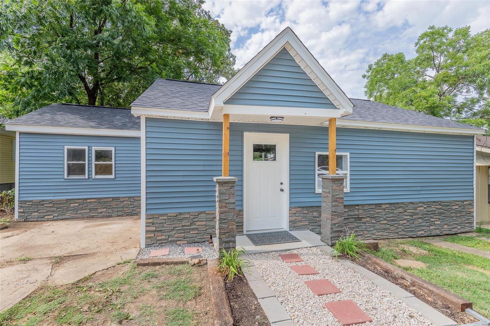 Stunningly remodeled home in the heart of Poplar Bluff! The charming exterior features new vinyl siding and stone, as well as a spacious back yard, covered front porch and patio and off street parking. Inside you'll be impressed by the airy, open floorplan featuring new vinyl flooring, sheetrock, paint, white shaker cabinets in the kitchen and bathroom, stainless appliances and so much more!