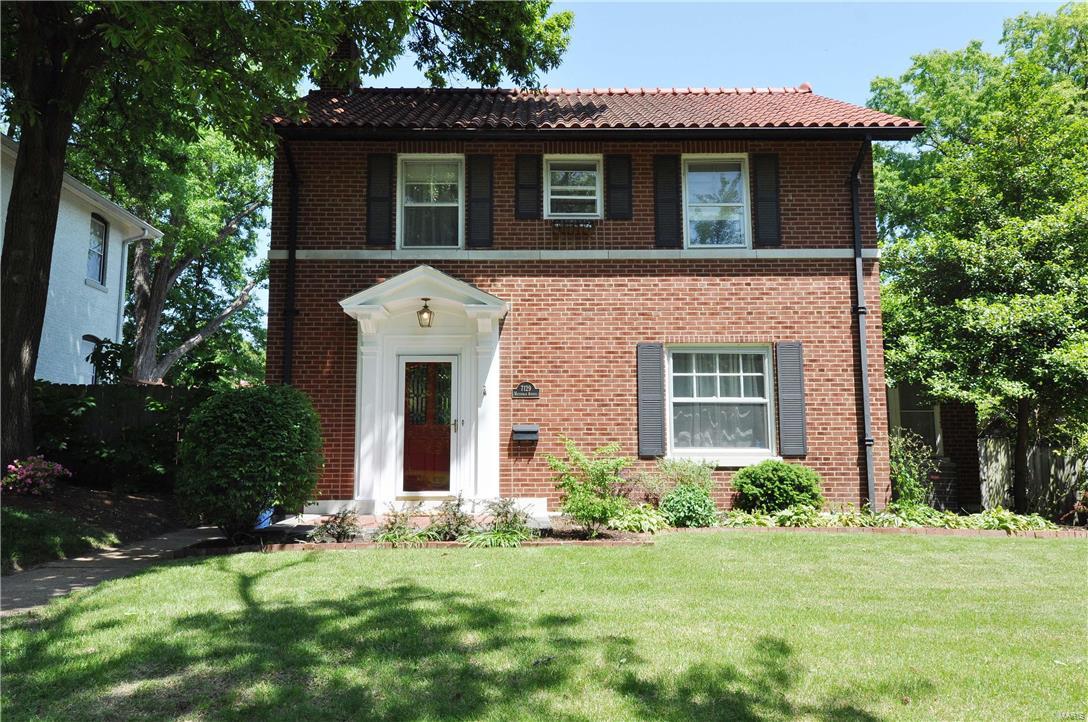 Est. 1927 Nestled among the elegant homes in the heart of U City this traditional brick home captures the charm of the area.  With a sprawling living room framed by a warm stairwell & oversized fireplace this area is truly a place to relax & gather. A formal dining room with solarium to the back patio create flow & allow fresh air & natural light to enter from all sides.  The galley kitchen is an updated nook for creating feasts for friends or family.  The recently renovated lower level boasts an iron stairwell leading to a office space, work-out room, full bath & large laundry room.  Closets abound making this entire level truly livable & utilitarian.  Upstairs is a  bedroom with large closet overlooks the landscaped yard. The master has two St. Louis closets & ample room for furniture. The large brick patio beckons for evenings around the fire pit or outdoor meals. The clay tile roof, 2car garage, old growth trees & landscaped garden complete the essential & wishes for U City living. COOL: 14 SEER+