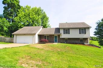 Immaculate home with great living spaces inside and out!  Updated flooring and fixtures make this a move in ready home!  Don't miss the enormous deck with fenced yard and private view.
