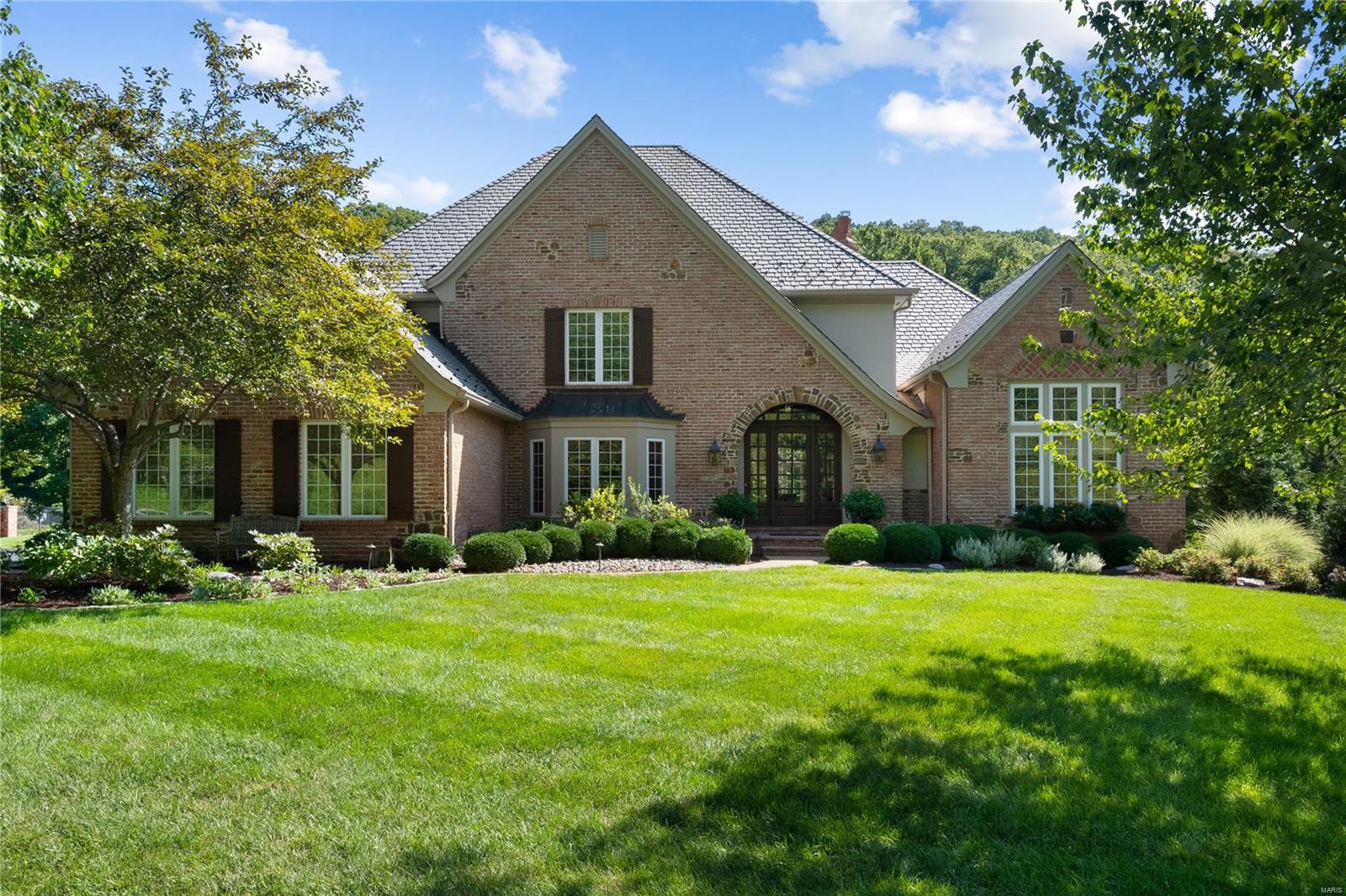 Back on market thru no fault of seller. Amazing value for this beautiful custom former display home in Cedars Valley. This home is wonderfully appointed & includes a private den/office w/built in bookshelves, all bedrooms are large & en-suite, newer DaVinci slate roof, & 18x16 screened in porch w/vaulted ceiling. Gourmet kitchen boasts islands w/prep sink, granite counter tops, counter seating, tumbled marble backsplash, & 42" cabinets. The floor to ceiling brick & stone fireplace is lovely addition to vaulted cozy hearth room that is bright w/transom windows overlooking vaulted screened in deck. Second staircase which leads from the kitchen makes for a convenient access to the three large bedrooms all with their own baths and a roomy loft area. The Main bedroom suite is large enough to live in alone. There are two large walk-in closets w/ finished shelving. The bedroom is enormous & currently serves as a bedroom w/a TV room and the main bathroom has been updated beautifully.