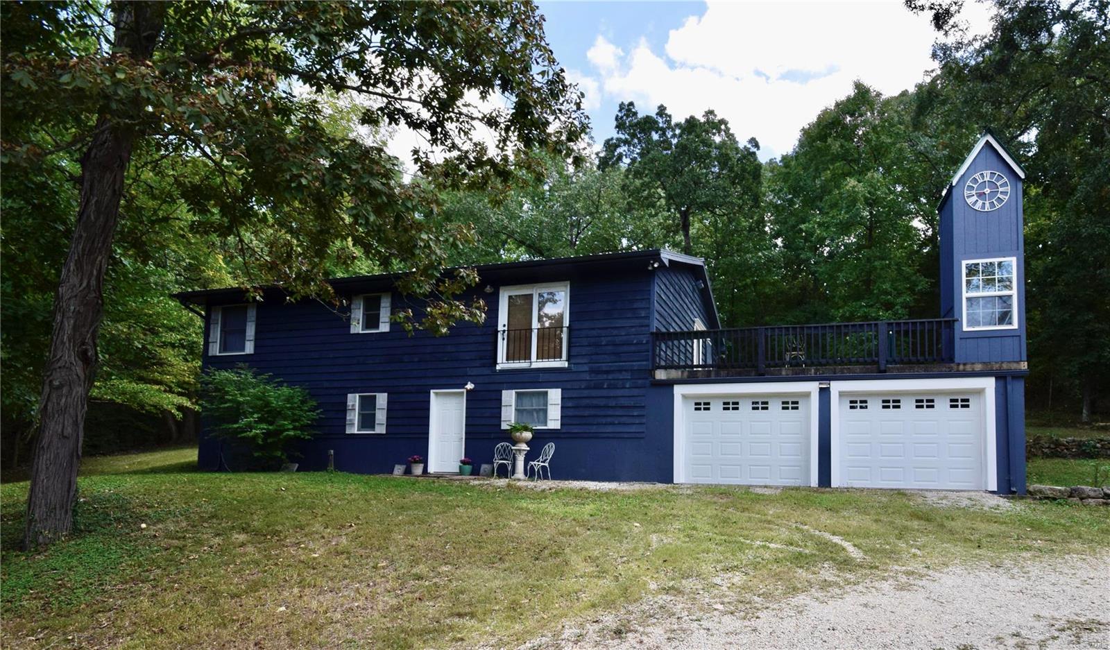 HILLSBORO RANCH on 3 ACRES (+-)! Lots of privacy here! This heavily wooded lot means you will see no neighbors and enjoy your unrestricted property as you see fit! Sellers have made meticulous upgrades during their ownership including a beautiful kitchen with thick slabs of GRANITE and SS appliances as well as a main floor laundry! GLEAMING HICKORY wood flooring, professionally installed crown molding throughout. ALL 3 bathrooms have been fully updated as well! HUGE MBR suite! METAL ROOF 2011. Water Softener and filtration 2018. Water Heater 2019, A/C 2016, Garage Doors 2019, Well Pump 2015,  Supplemental Wood Furnace, 2X6 Construction and more! For entertaining there's a Massive concrete Patio with trendy Clock Tower, sure to be the talk of all your friends! Massive garage is perfect for your two cars and all of your projects. LL rec area with kitchenette, extra storage, full bath, bedroom and office. Move in ready! Showings start Monday 09-19! No Drive-by's please! Very private!