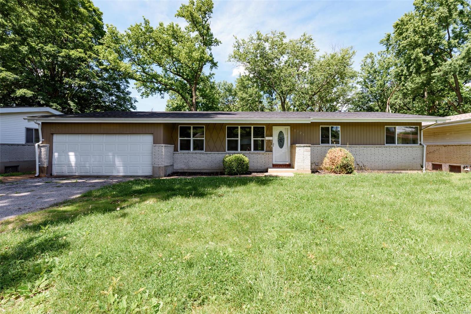 Welcome to 10721 Hallwood Dr, a freshly rehabbed gem in St. Louis, MO! This stunning home features brand new paint, floors, and lighting throughout, creating a bright and inviting atmosphere. The beautiful kitchen is a chef's dream, complete with stylish cabinets and ample counter space. Enjoy the expansive, level lot with a large backyard, perfect for outdoor entertaining or quiet relaxation. Located in a quaint, quiet neighborhood, this home offers tranquility while still being close to local amenities. Don't miss your chance to own this beautifully updated property, schedule your showing today!