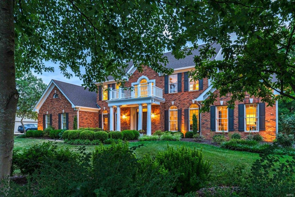 Beautifully designed 1.5 Sty in prestigious Manderleigh of Town & Country. This Taylor Morley-built home features exceptional craftsmanship & custom amenities throughout including oak hardwoods, detailed trim work & palladian windows. Impressive 2-sty foyer leads to private study with French doors, formal dining room and stunning great room with marble fireplace & dramatic wall of windows. Spacious open kitchen with 42” cherry cabinetry, granite countertops, KitchenAid appliances & 5 ½’ center island adjoins light-filled breakfast room with convenient planning center & vaulted gathering room. Coffered master bedroom suite offers an appealing retreat with His & Hers walk-in closets & luxury bath with jetted tub. T-staircase accesses 3 generous-sized additional bedrooms, 1 with ensuite bath & 2 with Jack n’ Jill bath. Walk-out Lower Level includes recreation room with brick fireplace & wet bar & full bath.  Atrium doors open to outdoor living area with gazebo, deck & patio.