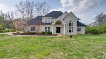 Truly a ONE of a kind custom home.. the second you pull up you will notice the freshly updated landscaping and brand NEW roof. Walk into the grand foyer with 18ft ceilings and brand new tile. Great room, office, dining room, kitchen, breakfast room and master bedroom all have real 3/4 inch new solid hardwood flooring. Kitchen is HUGE with all new Kitchen Aid Appliances, LED can lighting, quartz counter tops and custom cabinetry. Whole home has been converted to LED Can lighting. Main floor laundry right off of the kitchen leading to the oversized 3 car garage. Main floor master bedroom with coffered ceilings, all new lighting and a HUGE master bathroom with two closest, whirlpool tub, double vanity and shower. Great room has 18ft Celings, gas fireplace and leads to the newly painted deck. Upstairs you'll fine 3 large bedrooms, newly renovated bathrooms and walk in closets. Entire home from top to bottom has been painted, doors, base, ect. Don't wait this home will NOT LAST LONG!
