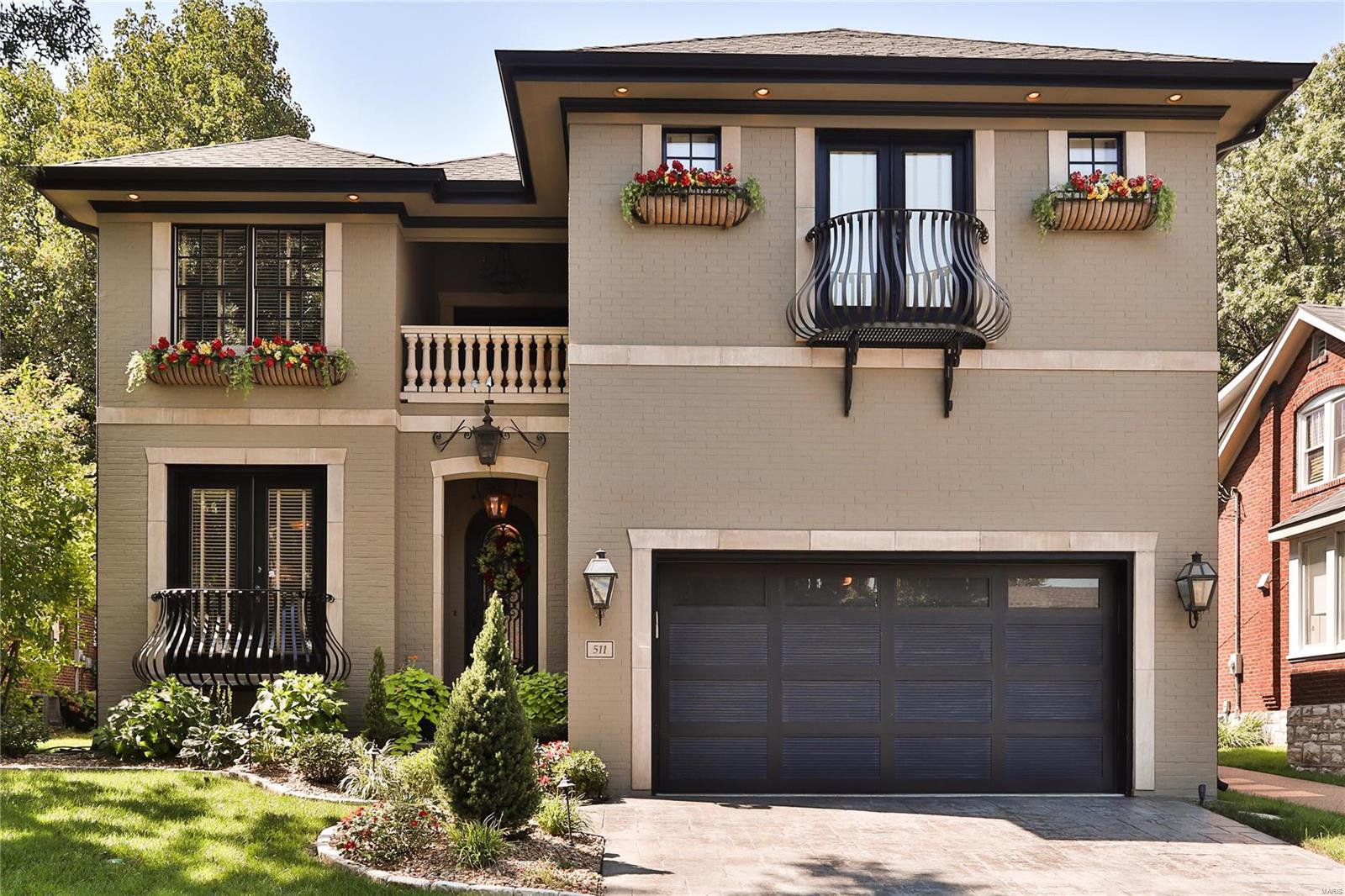 University City Oasis with Dramatic Spaces!  8 Year Old 1.5 Story Custom Home Just Steps from Clayton.  This Hansom Residence is Built for Today’s Lifestyle.  Open and Airy.  10’ Ceilings, Triple Crown Moldings, Handscraped Walnut Flooring, 4 Gas Fireplaces, Custom Wrought Iron Doors, Complete Whole House Sonos Surround System!  Gourmet Kitchen with w/ 4” Granite Counters, Custom Cabinetry w/ Glass Fronts, Wolf /Sub Zero/Asko Appliances, Pot Filler, Under Cabinet Lighting.  Master Suite with Coffee/Wine Bar.  Two Laundry Areas. Vaulted Hearth Room, Great Room with Access To Backyard Serenity: Covered Porch and Pebble Tec Salt Water Pool with Water Fall, Professionally Landscaped with Inground Sprinkler System. Wine Cellar. The Finished Lower Level Has It All:  Stone Wet Bar with Secondary Kitchenette, Theatre Area, Game Room, Exercise Room, Guest Suite with Full Bath.
