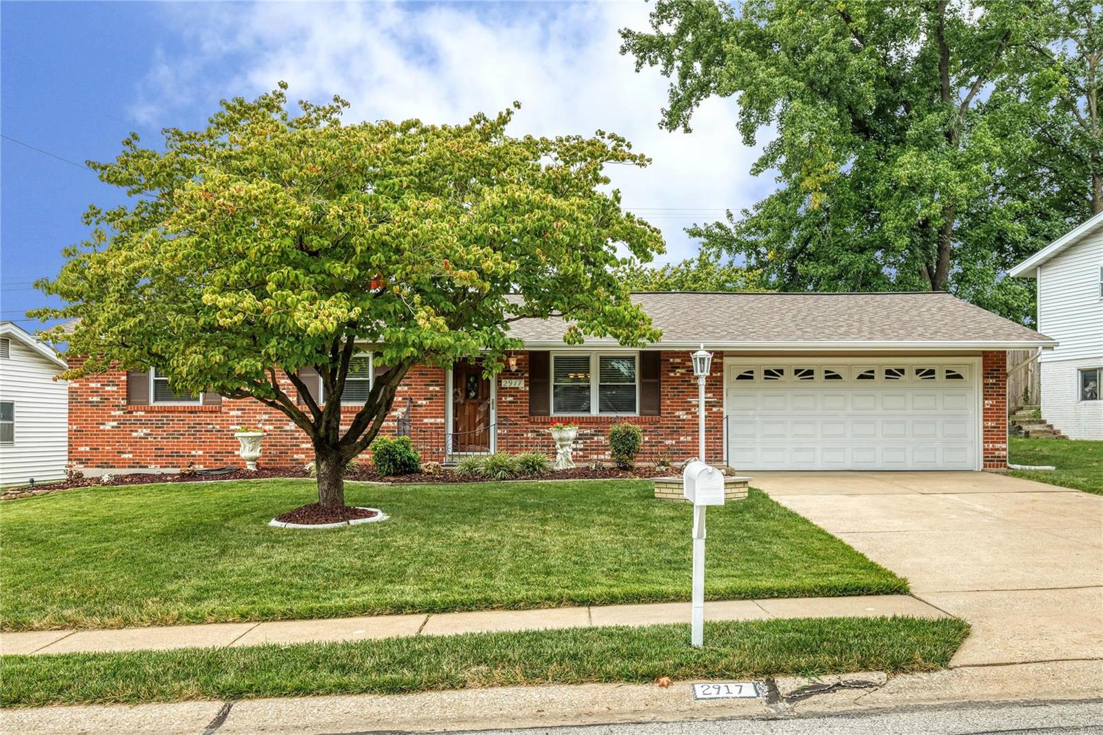 Perfectly located near McNair Park and Lindenwood University, see this beauty and immediately fall in love! From the brick exterior, meticulous landscaping, covered front porch, newer roof (2016), vinyl siding (2017), updated windows, to the wood entry door w/ stained glass, you’ll be charmed before you hit the driveway! Step inside and find all 3 BRs have overhead lighting w/ fans, an updated hall bath, master bedroom w/ a fully updated bath, incl floor to ceiling tile shower surround. A spacious eat in kitchen w/ plenty of storage and an oversized garage complete the main floor. The basement is full, dry, well-lit and ready for any finishing touches you may want to add (currently a woodshop). You’ll be the envy of the neighborhood sitting out on your 20x20 patio, w/ gas grill, landscaping and access to McNair Park! Just minutes away you'll find all the shopping, restaurants & entertainment of Main Street St. Charles, Streets of St. Charles, and easy access to Hwys 70/270/370, 94/364!