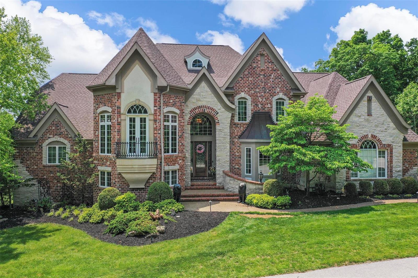 Marvel at this magnificent 1.5 story home on a serene level 2.47-acre lot backing to trees! This 6800 sq ft home boasts an open and light filled floor plan. The grand foyer features custom archways, an open staircase and gorgeous lighting. The 20 ft great rm with custom millwork and FP captures the surrounding views by scores of windows. The stunning open kitchen/breakfast/hearth room features granite countertops, SS Dacor/Subzero appliances. The separate dining room features coffered ceiling and elegant lighting. Main floor master suite has custom walk in closet and a spa-like master bath w/tub and walk in shower. The 2nd floor offers an office, 3 beds and 2 full baths. The walk-out LL, is an entertainer’s dream: state-of-the-art media room, game area, custom bar, TRUE refrigerator/cooler, oversized bath, and wine cellar w/cigar humidor. Add'l features: Firepit, main floor laundry, whole home surround sound, and exercise room. This home is centrally located and is truly spectacular! Additional Rooms: Mud Room, Wine Cellar