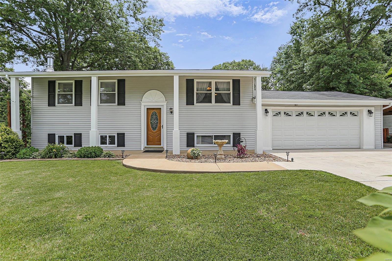 Wonderful split level home situated on a half acre! This home is close to everything Arnold and Imperial has to offer! 
The oversized, attached 2 car garage does not take up basement space here like most split levels and offers a carport as well! New carpet just installed on the main floor. The kitchen is beautiful boasting stainless steel appliances and plenty of cabinet space! 2 generous sized bedrooms on the main floor and a full bathroom. The lower level offers a family room with a wood burning fireplace, a bonus room, 3rd bedroom and another full bathroom! You'll love the large covered deck overlooking the private back yard complete with an above ground swimming pool and lots of patio space!