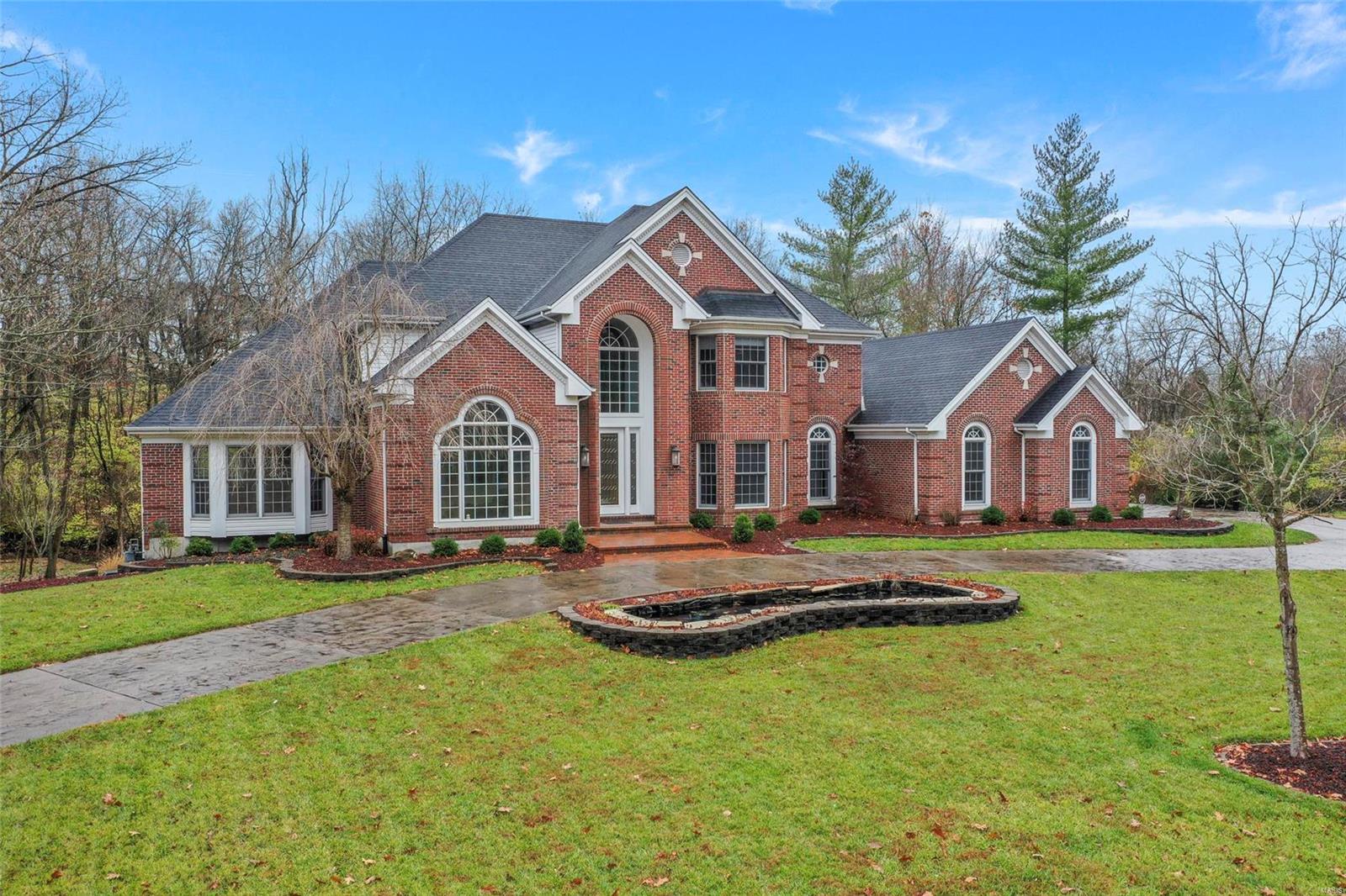Spectacular 5 bed and 5 full and 2 half bath home with 2 additions and 2 acres of divisible land in the Mason Ridge School District in the heart of town and county.  Brand new kitchen, nearly untouched kitchen features professional Wolff gas range and stainless steel SubZero built in refrigerator.  Muted ashed cabinets highlight the stylishly designed chef's kitchen perfect for family gatherings, entertaining large parties with the kitchen highlighted as the center point. Hearth room has view of the beautiful backyard with peaceful water features. The master on main suite has a completely new bathroom with separate shower, beautiful standing tub, dual sinks and separate water closet.  Three ensuite bedrooms have private baths and a cozy loft.  Amazing finished basement has bedroom, full bath, family room with fireplace, bar, gym, office, game room and tiled private spa room overlooking the soothing water features. Oversized three gar garage.  Cul de sac.  Award winning schools.