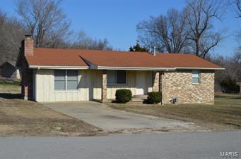 Remodeled and move-in ready! This well maintained ranch style home with super spacious living room and attractive brick fireplace is waiting for a new family to call home! Many updates in 2013 include...all new carpeting , laminate flooring, interior freshly painted, ceiling fans, light fixtures, replaced baseboards, new faucets & bath tub and upgraded breaker box to 200 amp. Amazing new kitchen with all appliances new in 2013. 12x14 deck for entertaining and 24x24 detached carport.