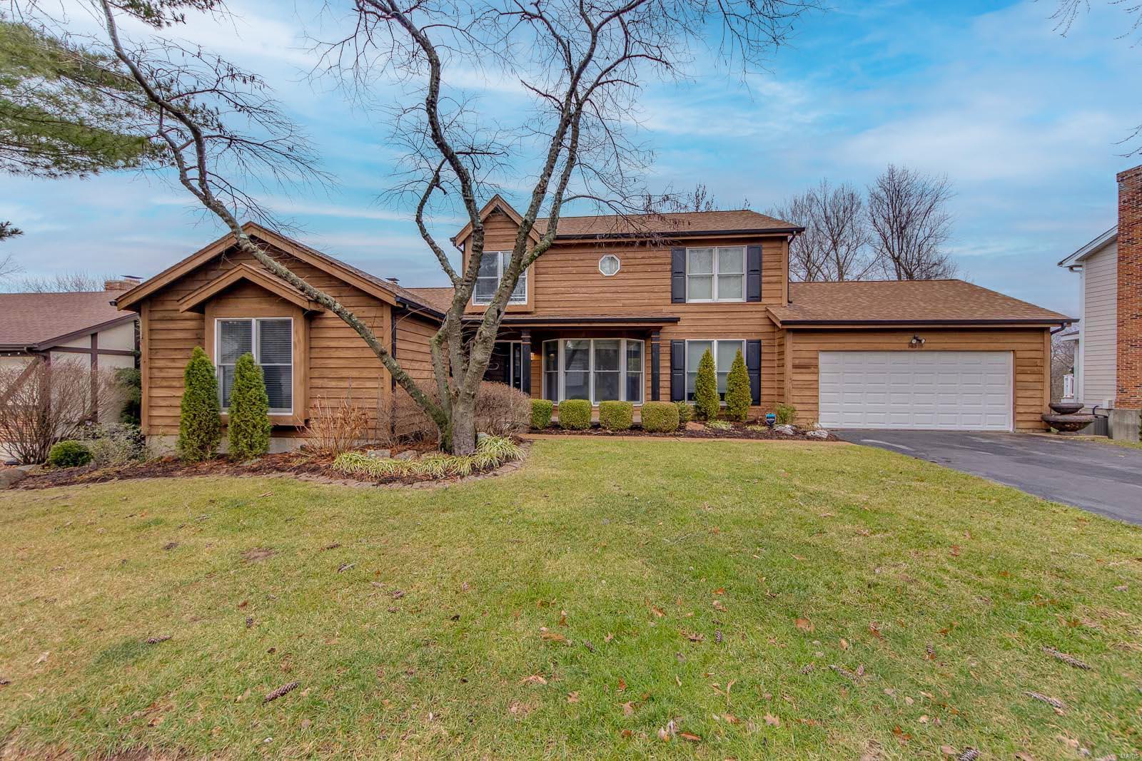 Here it is - a rare chance to own in the Chesterfield Valley neighborhood! Privacy and convenience are the name of the game with this 1.5 story Wildwood gem. Sprawling hardwood floors, updated finishes & molding, and many other conveniences appoint this home throughout starting w/ an incredible open kitchen w/ bar seating, spacious eat-in area and nearby family room w/ wood burning fireplace. Bay windows allow you to enjoy the view of your private fenced-in lot. Pamper yourself in the amazing vaulted master suite and unwind in the elegant bathroom w/ jet tub, dual sink vanity, and separate shower. A formal dining room and living room are found in the front of the home, and main floor laundry and a 3-car garage complete the main level. Upstairs find 3 more sizeable bedrooms all w/ walk-in closets and attractive finishes. The walkout lower level boasts a massive bedroom, full bath, 2 more bonus rooms, a huge walkout rec room, and plenty of extra storage! You won't want to miss this one!