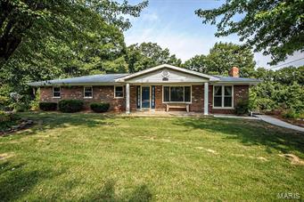 Lots to love about this house! All brick with vinyl siding for low maintenance outside. Sooo much space in this home. Start with the ceramic tile entry with nice coat closet, opens to the  big living room with lots of light which opens to the den with a w/b fireplace which is part of the dining room area. The kitchen is a Chef's dream, loads of cabinets and so much counter space. 3 bedrooms all with ceiling fans, the master has it's own full bath. The hall bath has been completely remodeled with marble vanity, ceramic tile floor and tile back splash around the tub.  The lower level has a family room with wet bar, and tons of storage, office space & 3rd remodeled bath. There is a small room that could be used for a studio/office. The 1 car garage is oversize with a 12X6 workbench area included.  The driveway will hold around 6 cars and the yard is fenced. The electric, furnace, A/C, Refrigerator, Microwave, flooring, carpeting, hall & basement baths, and garage door are all new.