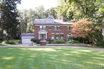 Exceptional 2.5Sty All Brick Beauty in Sherwood Forest  * Prestigious sought-after Somerset  Ave/One of Webster’s finest streets *Phenomenal park-like .84 acre * Impressive sweeping front lawn w/circle drive * Grand Entry * 9Ft Clgs on 1st * Leaded glass * T-stairs * 5BDRs/5Bths * Over 5100 SqFt * Gleaming Wood Flrs * Beautiful LivRm w/FP * Darling Den w/charming arched windws * Elegant DinRm w/Bay, French Drs & lrg Butler’s Pantry * Extraordinary 39X24 GreatRm w/2nd FP! Custom WetBar *Kit has 42 Cab, granite counters & newer Dshwshr 2014 * Sunny Brkfst Rm * Overlooks magnificent, private, wooded lot * Walks out to nice patio * Spectacular Master Ste w/Sitting Area & 3 Walk-in closets! 3 more BDRs & 2 full Baths on 2nd flr * 3rd flr is Fin for perfect teenagers bdrm hideaway! Plus FinLL w/9’ pour * Great large Media/Rec/Game Rm & Half Bath * Exercise Rm too * Great Updates: Furn 2009/Gar Dr 2010/AC 2012/Wet Bar Frig, Wtr Htr & New Arch Roof 2014 * Sprnklr Sys * Sec Sys * Welcome Home!