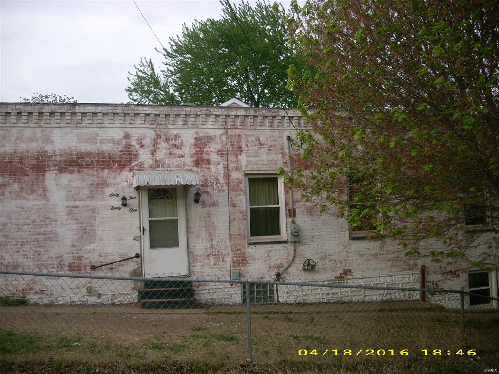 Brick home situated on corner lot. This property has spacious rooms, kitchen set up is in lower level, some wood floors, deck off bed room, fenced yard and one car detached garage.  Home need to be updated and some repairs. Please see attachment for PAS requirements and WFHM offer submittal information in MLS document section. SpecialListingConditions: Foreclosure