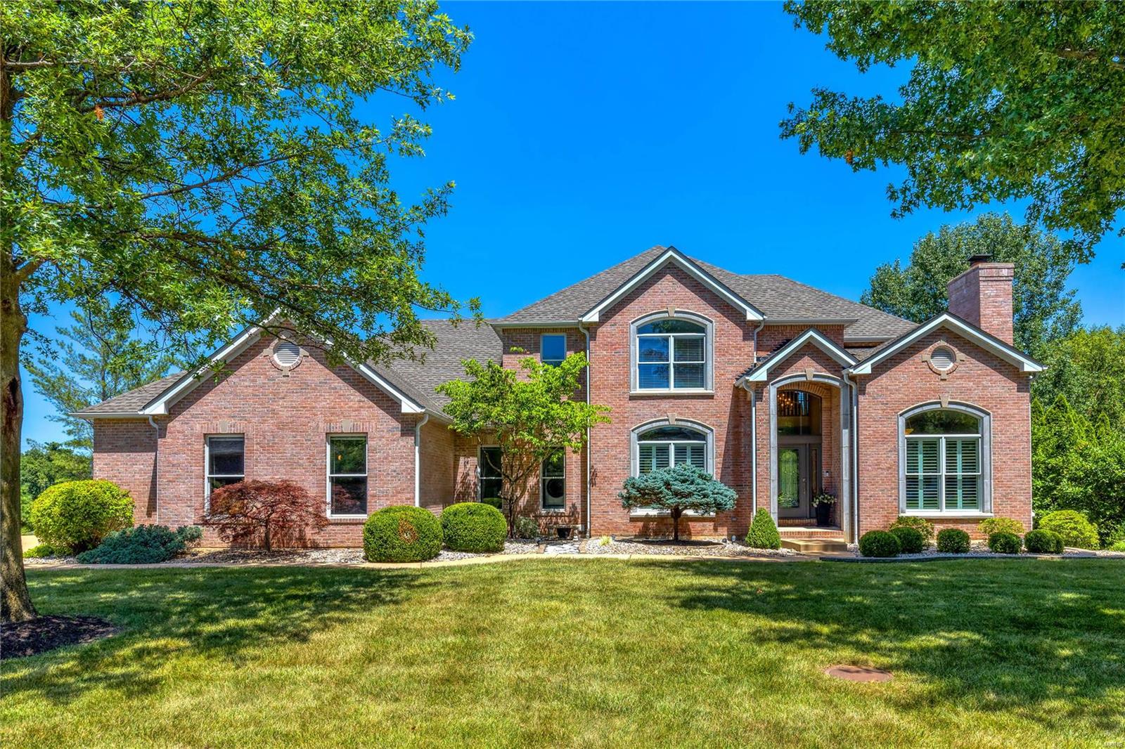 Schaeffer constructed full-brick 1.5 Sty in beautiful WindCastle. Impressive 2-sty foyer leads to private study with cathedral ceiling, floor-to-ceiling stone fireplace & French doors, formal dining room & spectacular great room with marble see-through fireplace, built-in bookcase & dramatic wall of windows. Chef’s kitchen with 42” white cabinetry, commercial grade appliances & 5’ center island adjoins light-filled breakfast / gathering room with brick & stone fireplace, butler’s pantry & atrium door that opens to screened porch. Spacious master bedroom suite with customized walk-in closet & Liston designed luxury bath with freestanding tub offers an appealing retreat. The 2nd floor extends the living quarters with 3 additional bedrooms, 1 with ensuite bath & 2 with Jack n’ Jill bath, plus bonus room. Lower Level entertainment space includes recreation room with wet bar, media room & full bath. Situated on a .9-ac lot with pool & patio with fireplace surrounded by landscaped gardens.