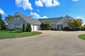 This home is uniquely designed to capture every view imaginable…… Lake views, sunrises, and sunsets!
It's sits on 2.69 acres PLUS OWNER HAS NOW ADDED 3.07 more acres immediately across the street from the home with no change in price! When you walk into the home you can see that the living area is conducive to large family gatherings-It's spacious and beautiful! The homeowner-designed kitchen is fantastic so pay particular attention to every detail. It lavishes all high-end qualities from appliances to countertops to the cabinetry itself. In describing this home, the word would be timeless. It not only boasts of elegance but also of comfort and warmth.  Hardwood floors, fireplaces and high end finishes are just a few features that make it special. This is a home that one needs to see before building. On the outside it has perfectly manicured landscaping, a lovely garden area, a private dock onto the lake and much, much, more. Owner will consider trade.