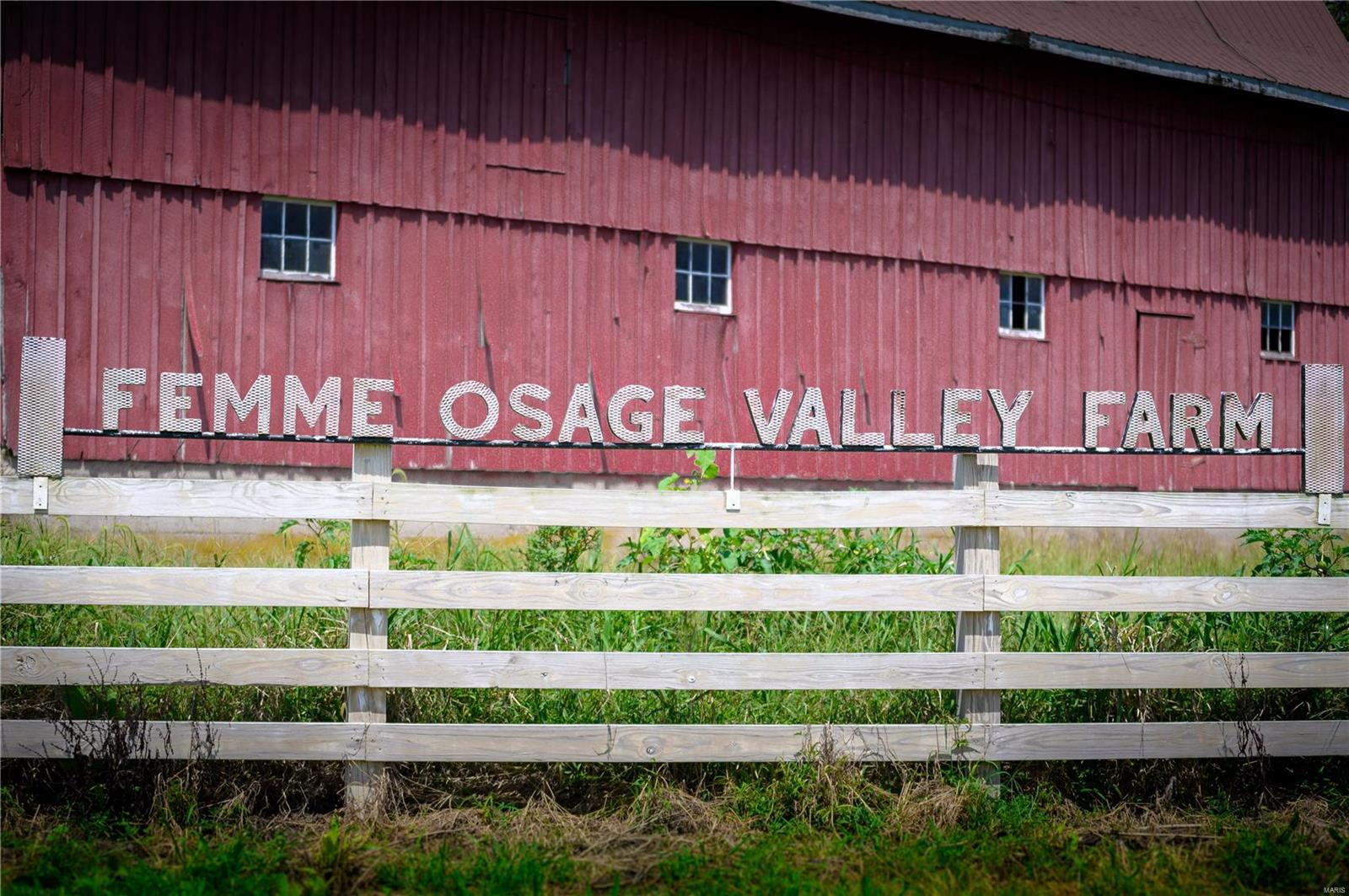 You do not want to miss out on this opportunity to own a 400 plus acre farm minutes from Boone Valley Golf Course and several renowned Missouri Wineries.  Femme Osage Valley Farm in Augusta, MO has a tremendous historical presence with rolling pastures, endless amounts of wooded forests, over 150 acres of tillable land and the Femme Osage Creek.  Set on the land; the main house dating back to Daniel Boone in the 1880's, a series of red barns with a masonry silo and several other outbuildings completing this picturesque property.