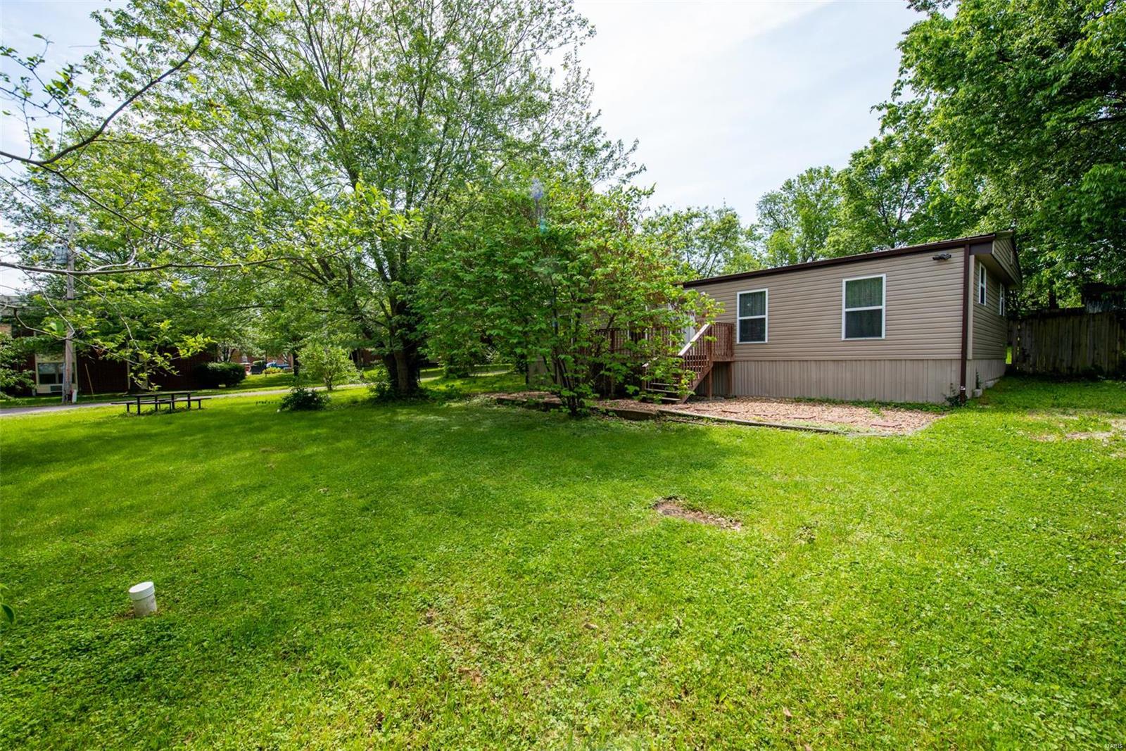 NEAT, CLEAN, and AFFORDABLE LIVING!! Nice 3 bedroom,2 bath, manufactured home situated on nice size yard.  This home offers kitchen with pantry, separate eating area, and Living room.  Some ceiling fans for keeping cool.  Fenced back yard, covered back deck and a nice size front deck.   SHOWING TO START WED JUNE 2ND AT 9AM
