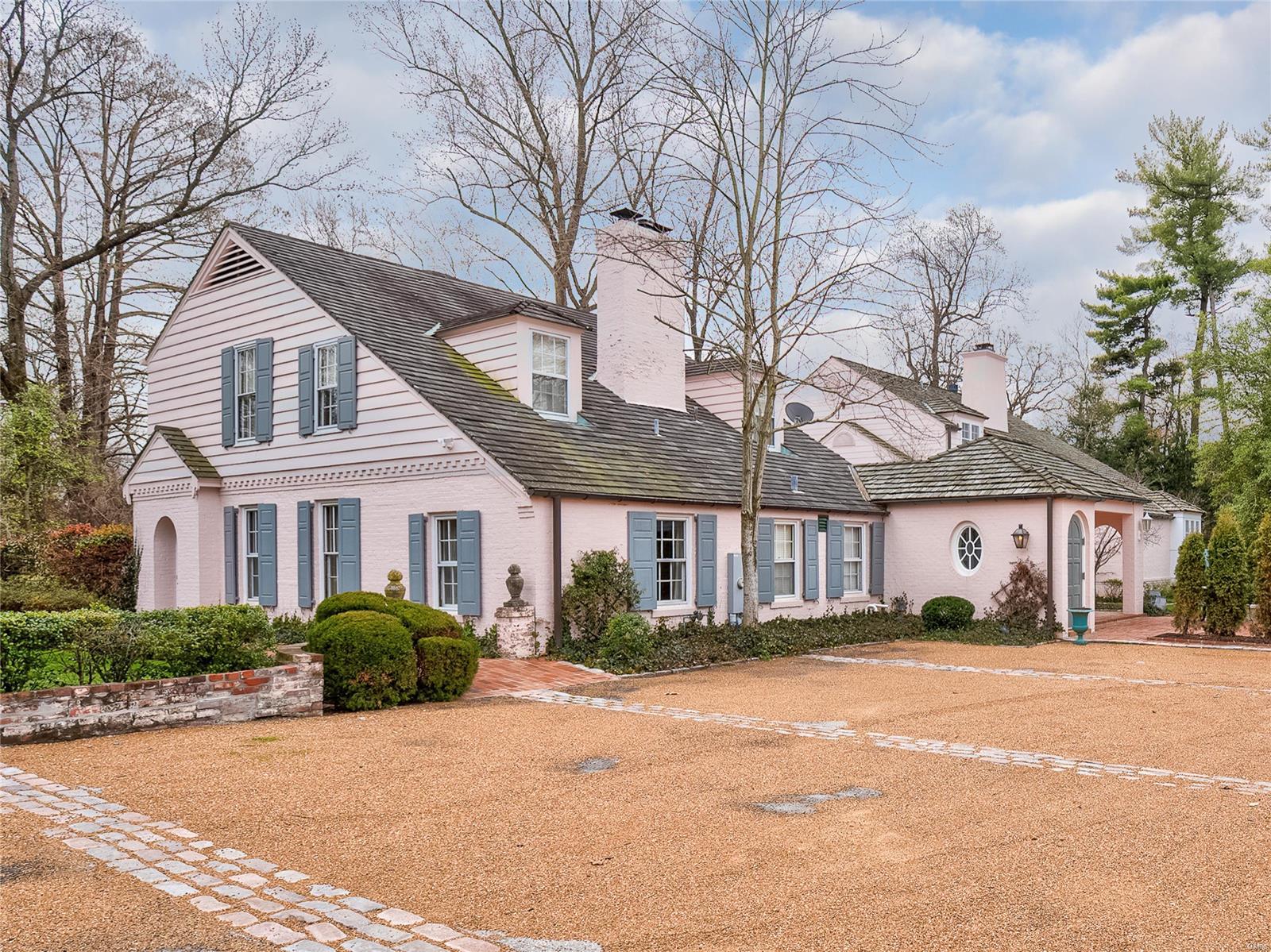 Welcome to Cobblestone Gardens, a timeless yet beautifully updated home in the heart of Ladue. This elegant 4-bedroom, 5-bathroom residence spans over 5,000 sqft and sits on half an acre of lush gardens and brick patios, offering unmatched privacy and tranquility. Meticulously renovated for a contemporary, relaxed lifestyle, this home features a gourmet kitchen with top-of-the-line appliances, perfect for the modern chef. The spacious main-level master suite boasts a cozy fireplace, a luxurious ensuite bath, and an expansive walk-in dressing area.The charming LR and DR, each with their own fireplace and stunning brick flooring, exude warmth and sophistication. Additional highlights include a two-car garage, a separate garden shed, and a generous recreation room—ideal for a playroom, media space, or potential in-law quarters. Experience the perfect blend of classic charm and modern comfort at Cobblestone Gardens—a truly exceptional home in one of Ladue’s most sought-after locations.