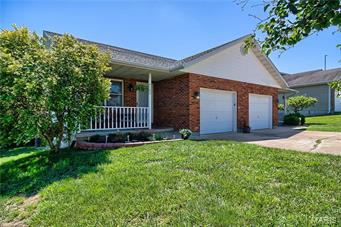 Get Ready to be Surprised! This duplex offers a ton of upgrades! Over 1750+\- square feet of finished living space! Pergo flooring has been added to the living room, dining area, and kitchen area! All the light fixtures have been updated! New six-panel interior doors and hardware have been added! Both bathrooms on the main level have been updated! Kitchen has updated hardware and stainless steel appliances that will stay with the home. The lower level offers family room, den/office with walk-out, large bedroom with access to the full bathroom with double vanity and stand-up shower! One-car garage! Backs to Trees!