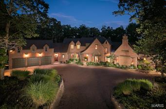 Approx 25 min west of Webster Groves. The current owners built their dream home w/architectural & interior design features reminiscent of English & European residences. Superior quality craftsmanship. Brick/stone exterior. 4 bedrooms, 4.5 ba's. Three levels of finished spaces. The 1st fl grand entry provides easy flow to the main living areas. The "signature rooms": a magnificent 2 story fam rm w/a cathedral ceiling; a formal dining rm w/box beamed ceiling; a butlers pantry; a WOW kit, hearth rm and a large screened-in porch. A laundry rm, office and pantry area. Large outside deck. 1st fl master ste and an magnificent wood paneled office/den. The 2nd fl features a Romeo & Juliet balcony over the fam rm, 1 bedroom suite, a large bathrm area utility rm. The LL has a large rec/fam rm, an outside covered patio area, a large exercise rm w/a hot tub and bathrm/spa. 2 bedrms and another full bath. Work shop & xmas storage. Large 3 car garage. 10 acre lake/dock. App 100+/- acres. Large shed.