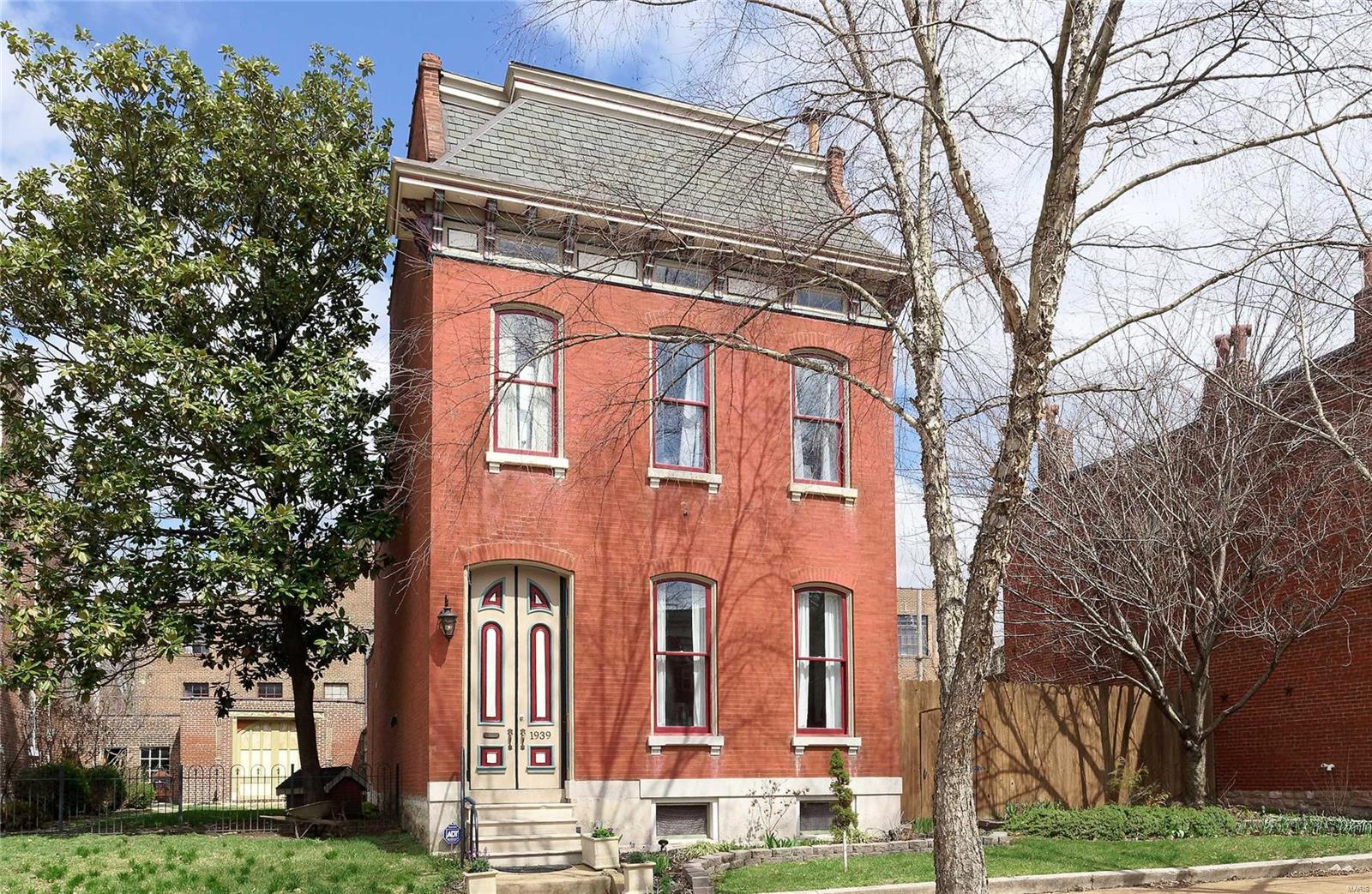 Stately 4BR, 3.5 Bath Victorian gem has wonderful portico, double entry doors, and stunning foyer with walnut staircase, open living and dining areas, crown molding, Brazilian Cherry flooring, exposed brick, 12' ceilings, fireplace, bay windows. Adjacent butler's pantry has sink, bar, wine racks, fridge and storage. Fully appointed Gourmet Kitchen with solid surface granite w/ island, vented cooktop, oven, 42" cabinetry and adjacent pantry for more storage.  2nd fl hosts 2 master BR suites w/full baths, and each a walk in closet, back suite has entry to deck with views of the large garden and City.  3rd fl boasts 2 additional bedrooms or office & 3rd full bath.  The professionally landscaped yard is amazing for seasonal parties and enjoyment.  This double lot has many beautiful features with pergola, sitting areas, patios and lush gardens including wonderful brick work.  The 3 car garage is great for project or that extra fun car!  Well maintained and close to tons of restaurants/park
