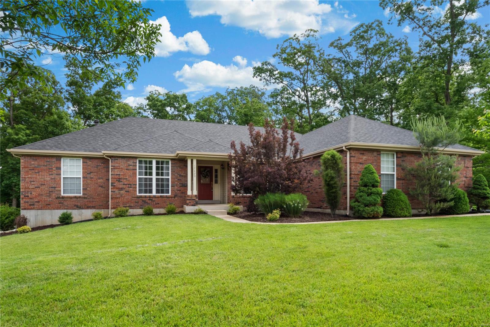 A 3000+ SQ FT RANCH - 5 BD/3BTH HOME ON 1+ ACRE LOT IN WILDWOOD!  INCLUDES FINISHED WALKOUT LOWER LEVEL, 3 CAR OVERSIZED GARAGE AND MAIN FLOOR LAUNDRY!  IT WILL NOT LAST LONG! Living room and separate dining room perfect for hosting dinner parties w/family and friends. Spacious family room w/vaulted ceiling and wood burning fireplace and large windows which let in an abundance of light. Adjacent is the breakfast room with a planning desk and kitchen with breakfast bar, plenty of cabinets and counter space. Main floor laundry. Large master bedroom suite w/vaulted ceiling and walk-in closet; the master bath includes separate soaking tub and shower, dual sink vanity. 2 add bedrooms and full bath on main floor. The partially finished walk out LL is great for entertaining with the spacious recreation room, wet bar area, 2 additional bedrooms and a full bath. Spacious private backyard w/ patio backs to trees and woods. ROCKWOOD SCHOOLS. MINUTES FROM DOWNTOWN EUREKA AND WILDWOOD TOWNE CENTER!