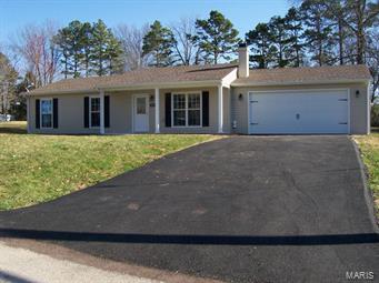 Gorgeous 3 bed, 2 bath ranch starter home with great curb appeal. Newer roof, windows, new vinyl siding, garage door, furnace & AC, white kitchen cabinets with breakfast bar. Woodburning fireplace with blower, oversized 2 car attached garage, beautiful wide plank laminate flooring through out except the 2 baths have ceramic. New asphalt driveway. Large patio overlooking the nice back yard.